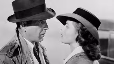 Humphrey Bogart and Ingrid Bergman looking at each other in Casablanca (1942).