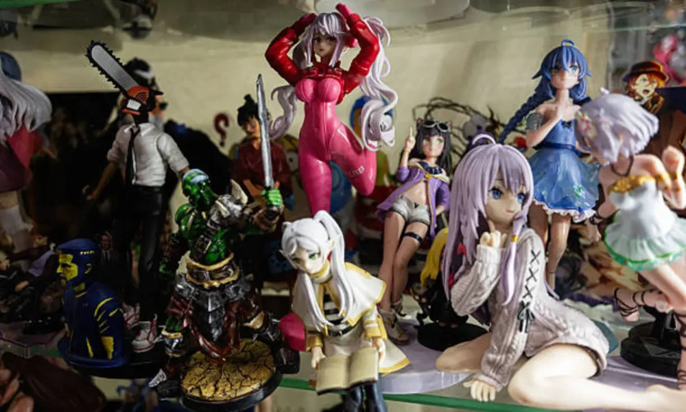 Collection of Various Anime and Manga Figures Displayed in a Glass Shelf