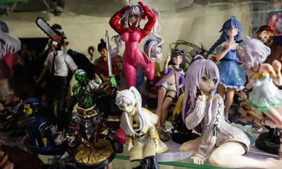 Collection of Various Anime and Manga Figures Displayed in a Glass Shelf