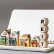 REIT symbol. Real Estate Investment Trust, Real Estate Investment Trusts with miniature houses Investment concept. copy space, business background