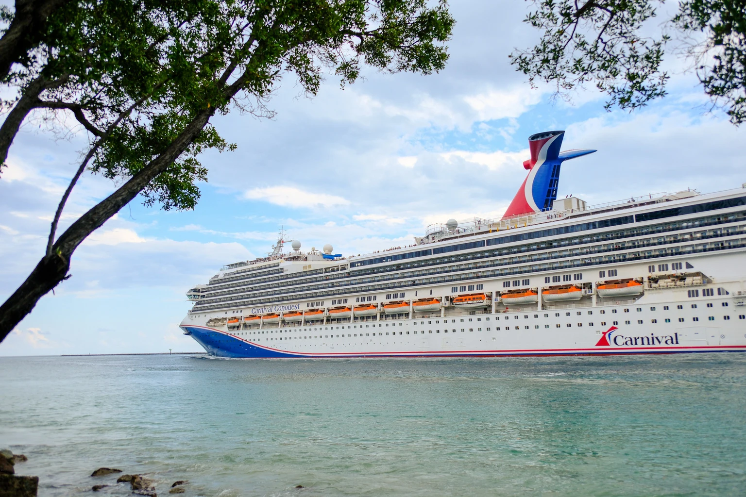 The Carnival Conquest cruise ship sailing out of the port of Miami, FL. Carnival Conquest is a 110,000 ton and 2980 passenger ship refurbished in 2026
