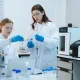 Scientist mixing chemical liquids in the chemistry lab. Researcher working in the chemical laboratory.