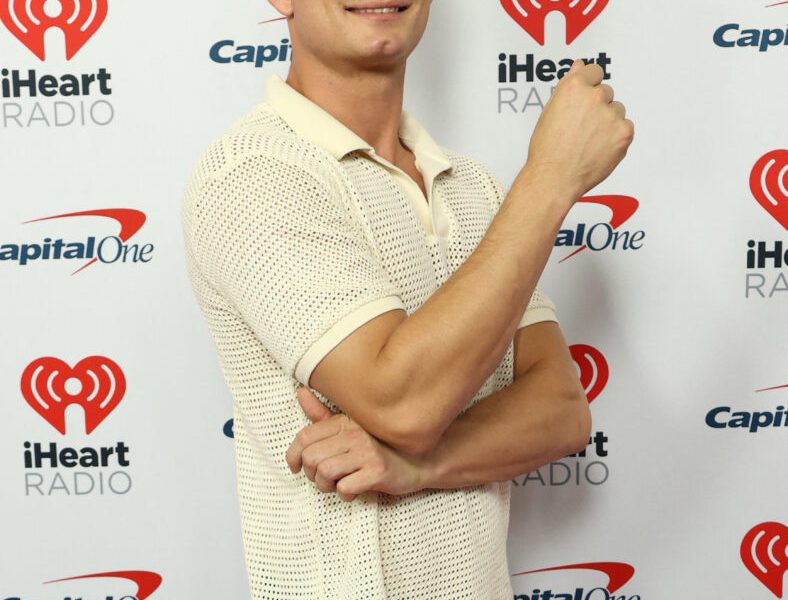 James Kennedy posing on the red carpet.