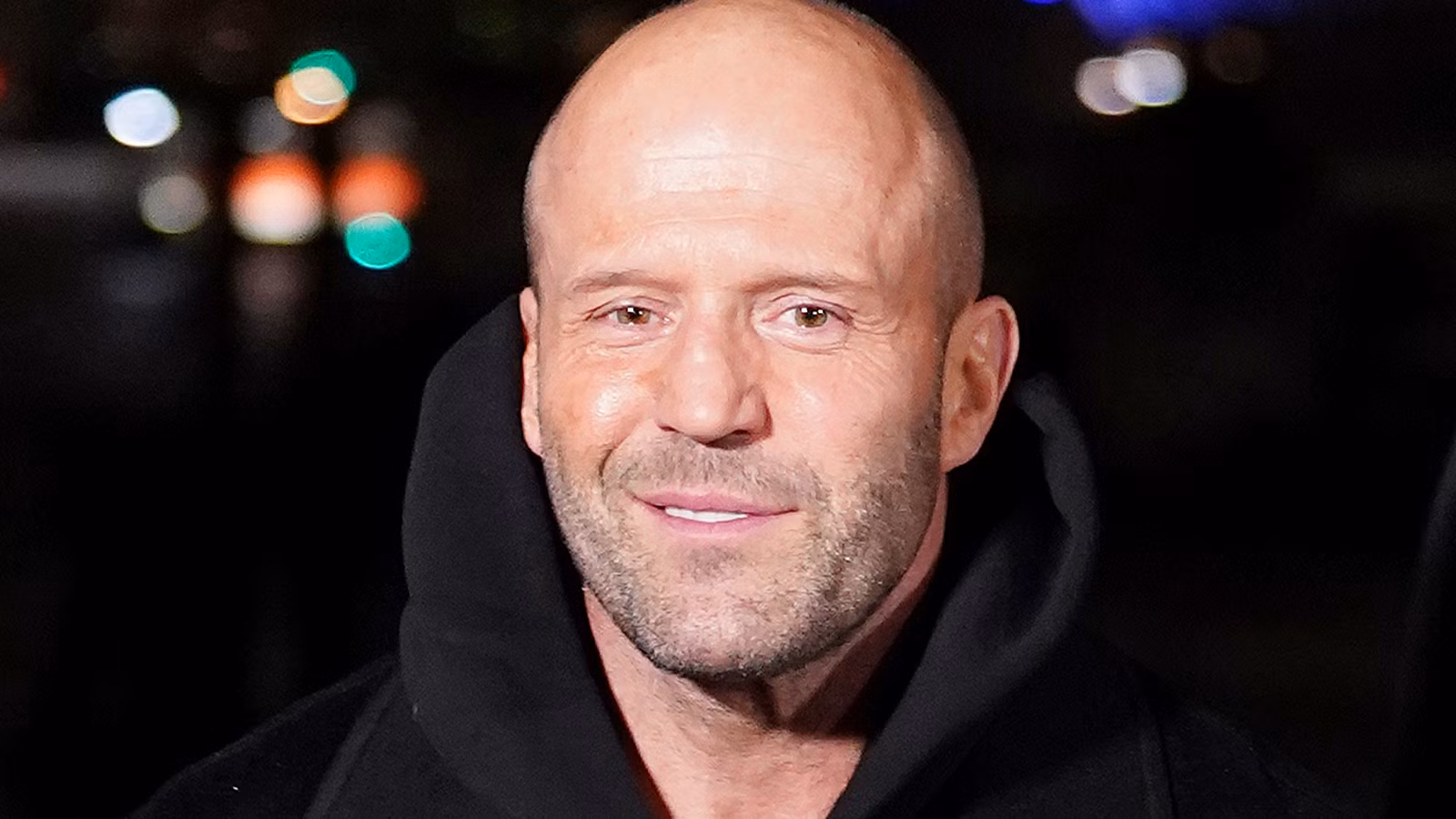 Jason Statham in a black hoodie on the red carpet