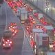 Two rushed to hospital after car flips on its roof and fuel spills across major motorway