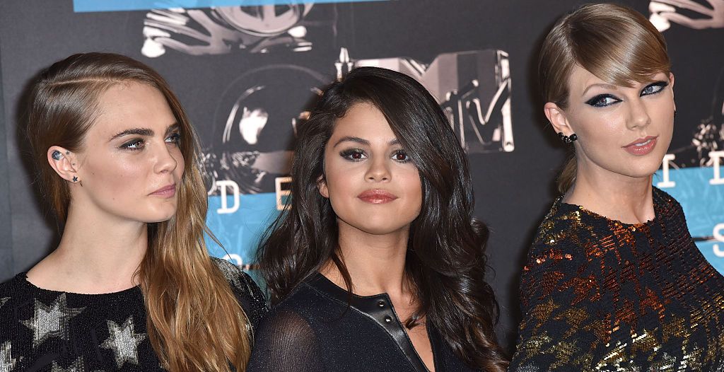 LOS ANGELES, CA - AUGUST 30: (L-R) Model Cara Delevingne, recording artists Selena Gomez and Taylor Swift arrive to the 2015 MTV Video Music Awards at Microsoft Theater on August 30, 2015 in Los Angeles, California.