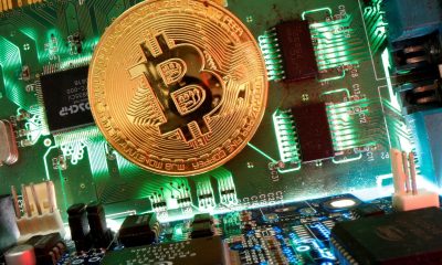 Representation of the virtual currency Bitcoin is seen on a motherboard in this picture illustration taken April 24, 2020.