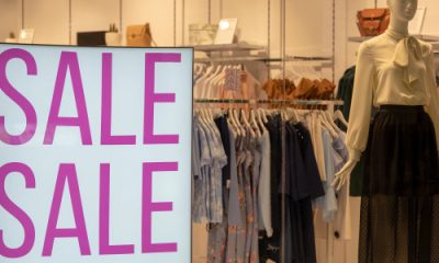 storefront with large SALE SALE sign