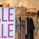 storefront with large SALE SALE sign