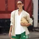 COPENHAGEN, DENMARK - AUGUST 05: Ambre Lipuma wears green Adidas shorts, white top, beige blazer, beige bag and sunglasses outside Tekla breakfast during Copenhagen Fashion Week day two on August 05, 2025 in Copenhagen, Denmark. (Photo by Raimonda Kulikauskiene/Getty Images)