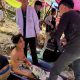 Rescuers free 4 men who had been trapped in flooded Laos cave and search for 2 still missing