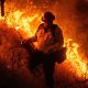 Raging wildfires churn through dry brush in Southern California