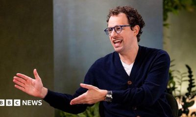 Dario Amodei, co-founder and chief executive officer of Anthropic, speaking during an interview in a room decorated with plants