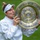 Marketa Vondrousova kisses the Venus Rosewater Dish at Wimbledon in 2023