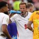 Harry Kane squirts water on his face during a hydration break in England's match against Croatia at the 2026 World Cup.