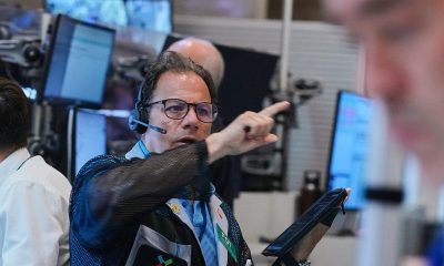 Wall St ends mixed as shares in tech companies slide
