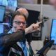 Wall St ends mixed as shares in tech companies slide