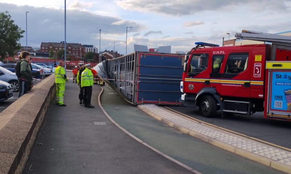 Emergency services respond after lorry overturns on Manchester Road