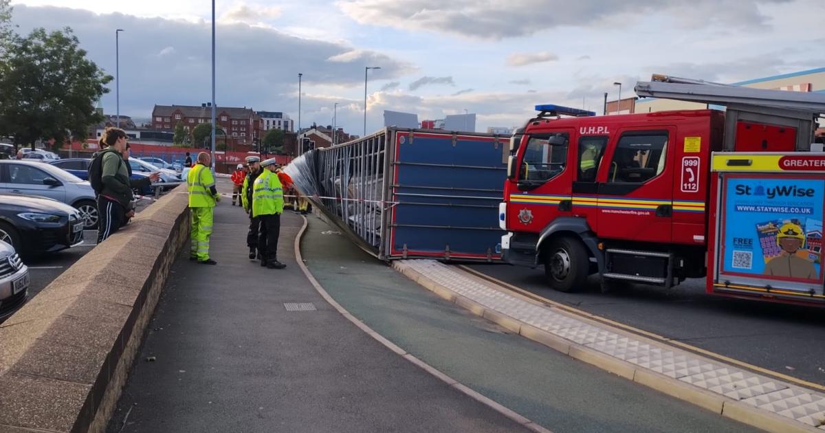 Emergency services respond after lorry overturns on Manchester Road