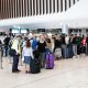 Six-hour airport queue warning as millions of Brits head abroad