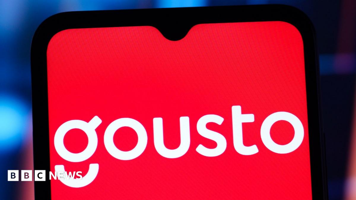 The white Gousto logo on a red background on a mobile phone