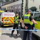 Police officers standing next to a cordoned-off area in Church Street, Welshpool