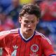 Scott McTominay in action for Scotland in the team's largely red change kit