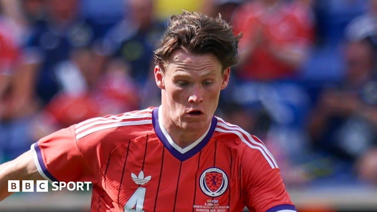 Scott McTominay in action for Scotland in the team's largely red change kit