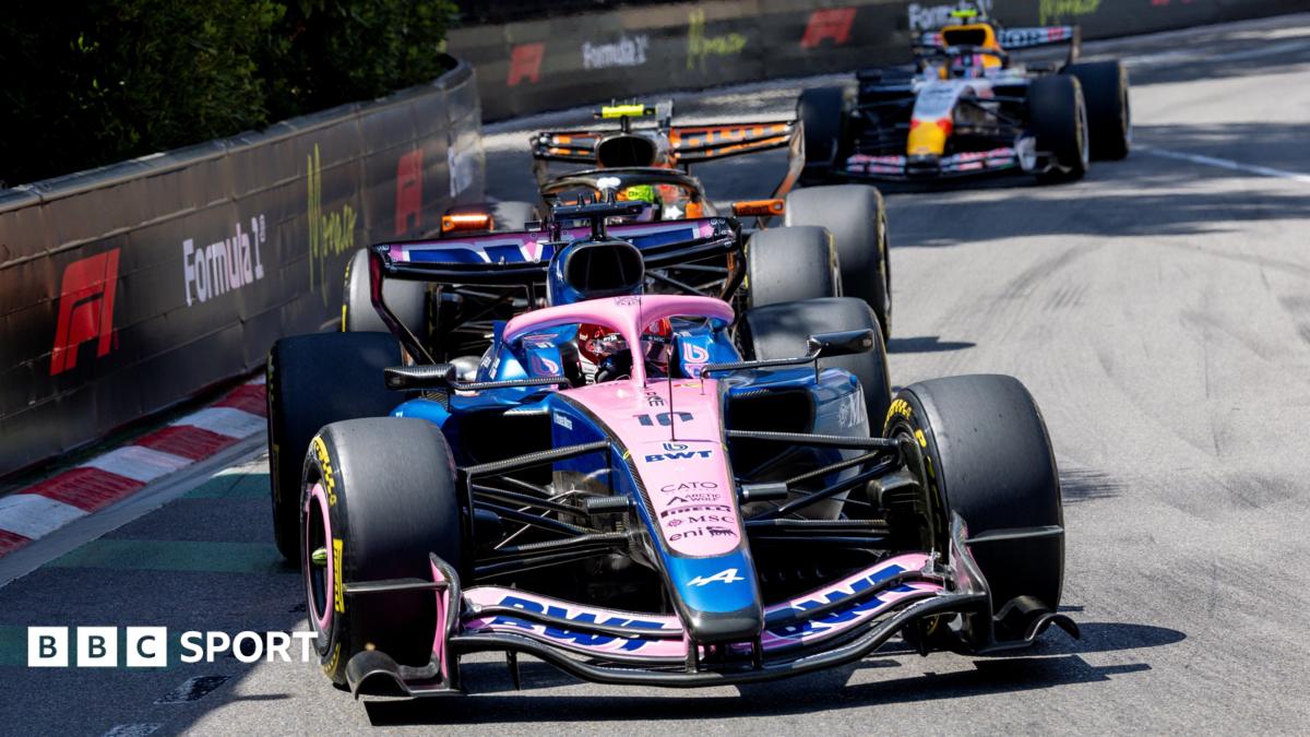 Alpine's Pierre Gasly with McLaren's Lando Norris right behind him, and a Racing Bulls in the background, approaching the hairpin during the Monaco Grand Prix