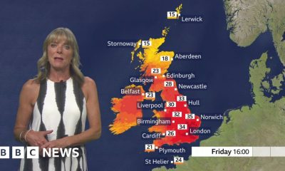 Louise Lear in front of a red UK map