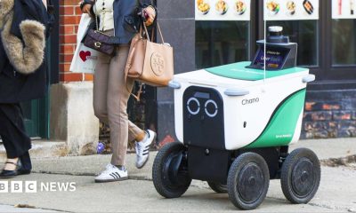 A delivery robot on a sidewalk in Chicago