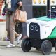 A delivery robot on a sidewalk in Chicago