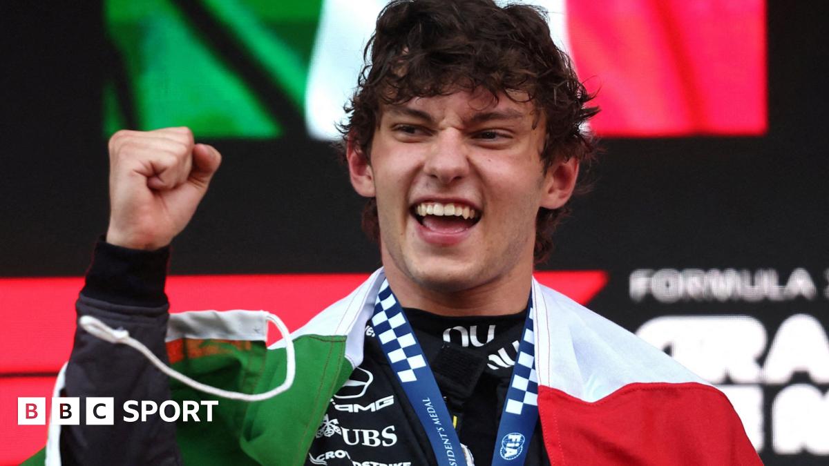 Kimi Antonelli with the Italian flag draped around his shoulders after winning the Monaco Grand Prix