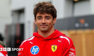 Charles Leclerc poses in the paddock ahead of the Canadian Grand Prix