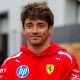 Charles Leclerc poses in the paddock ahead of the Canadian Grand Prix