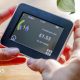 Someone holding a smart meter