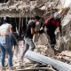 Family members and volunteers search through the rubble after two 17-story buildings in the Belo Horizonte residential complex collapsed in Catia La Mar, La Guaira (Venezuela), on June 26, 2026.