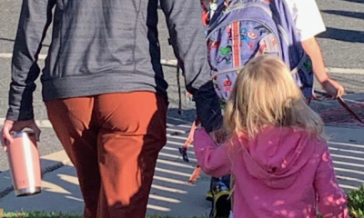 The author walking her children into school on their first day.