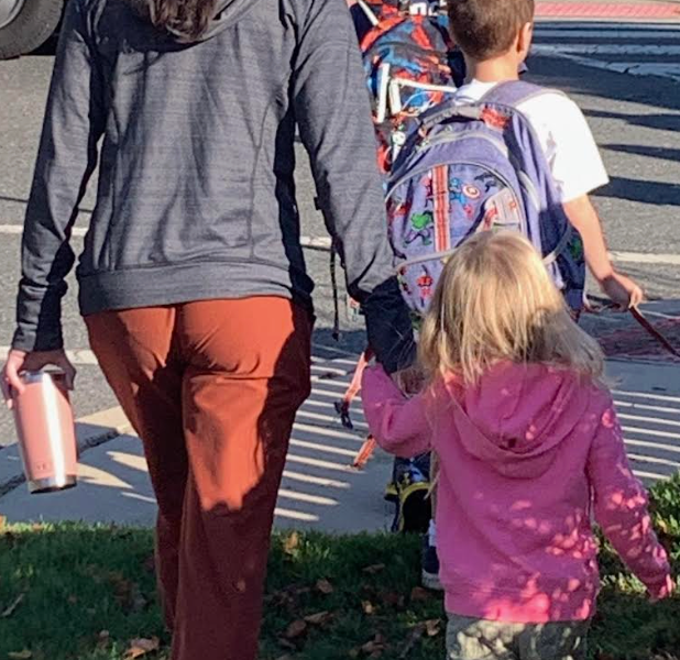 The author walking her children into school on their first day.