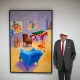 David Hockney posing with one of his art pieces in 2015