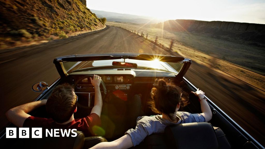 Is the convertible car heading into the sunset?