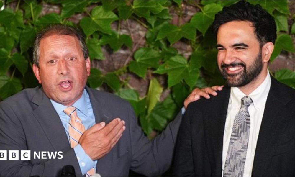 Brad Lander, candidate for New York’s 10th Congressional District, stands next to New York City Mayor Zohran Mamdani during a watch party after winning the primary elections in Brooklyn, New York