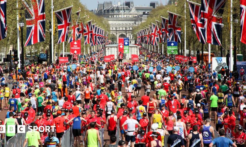 Runners cross the finish line at the London Marathon