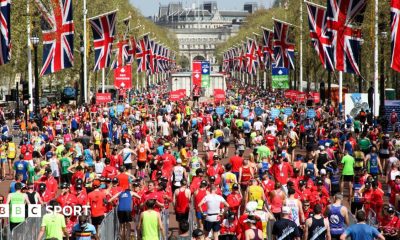Runners cross the finish line at the London Marathon