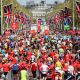 Runners cross the finish line at the London Marathon