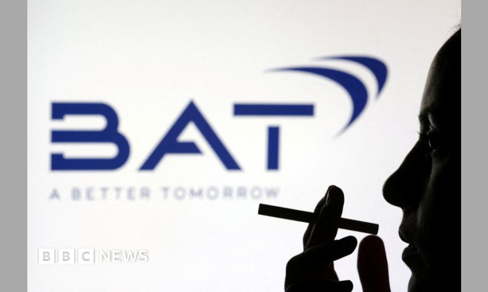 Silhouette of a person holding a cigarette in front of a dark blue BAT logo on a white background