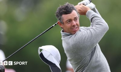 Rory McIlroy's cap flies off on the 13th hole