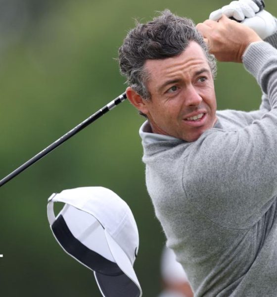 Rory McIlroy's cap flies off on the 13th hole