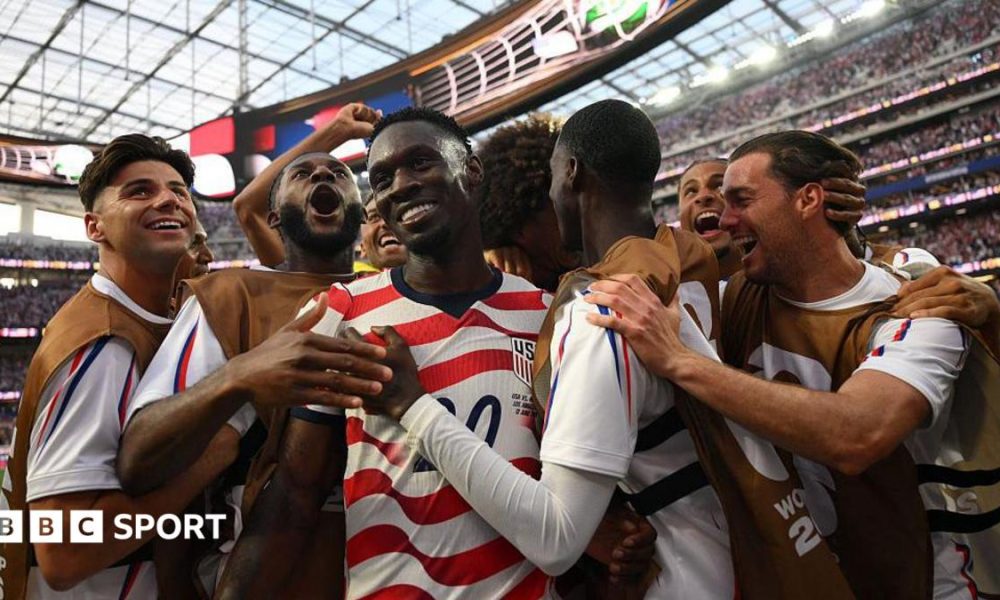 USA players celebrate scoring against Paraguay