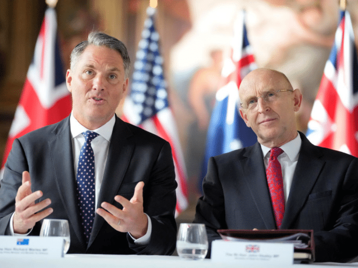 (L-R) Australian Defence Minister Richard Marles and UK Defense Secretary John Healey sit together for the AUKUS Defence Ministers Meeting at Old Royal Naval College on September 26, 2024 in London, England.